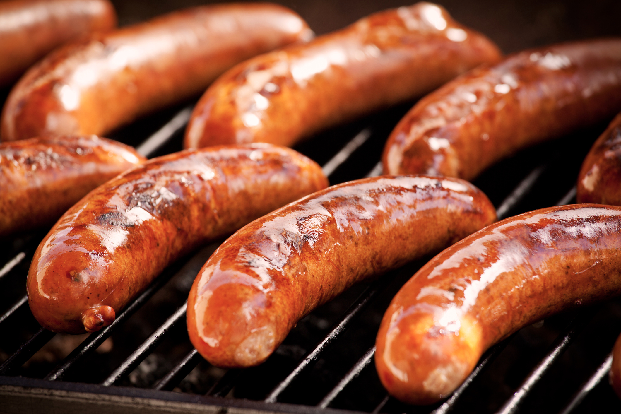 Bunch of tasty sausages on the grill